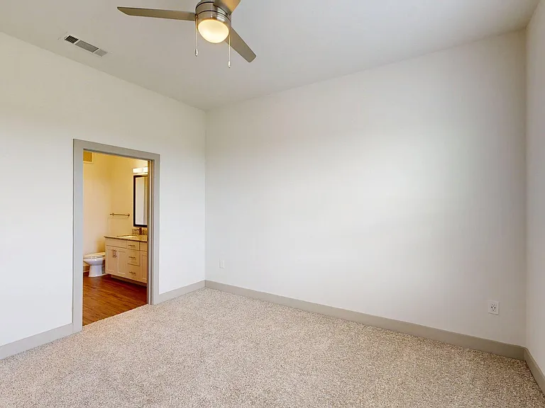 Spacious apartment Bedroom with Carpet Floor.