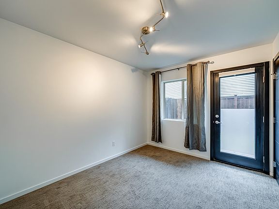 Lower level bedroom with door to yard