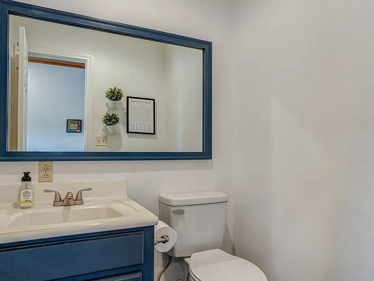Lower level half bathroom.
