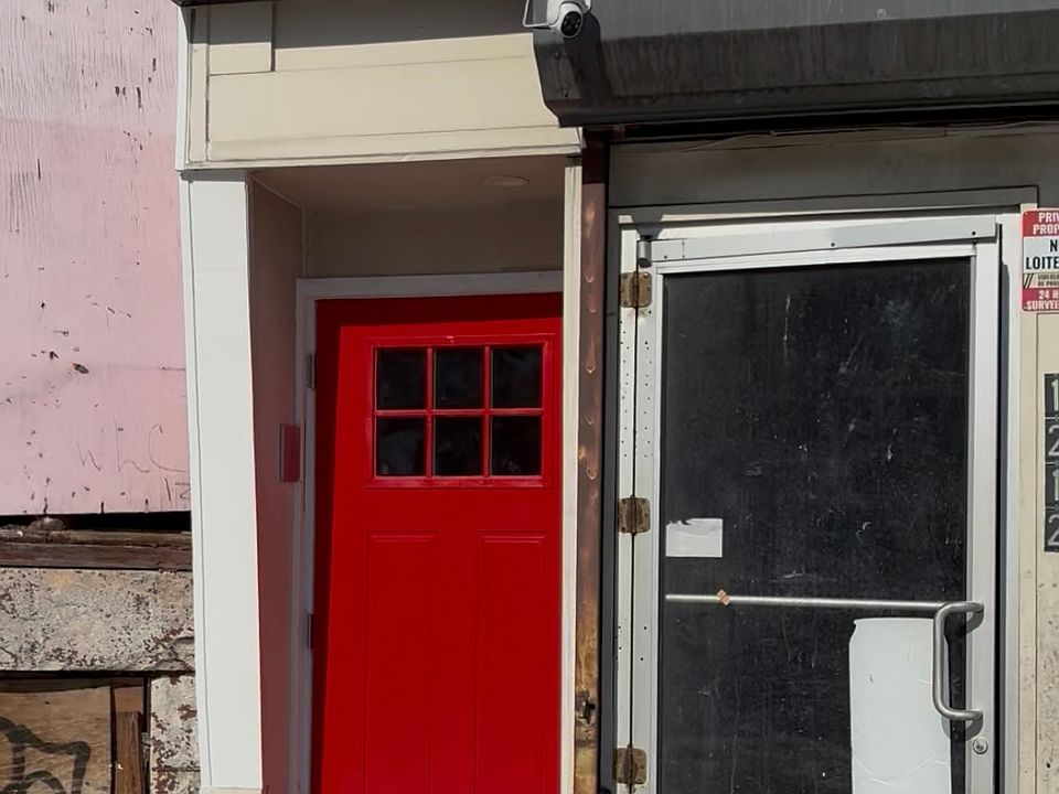 Entrance to enter building (Red Door)