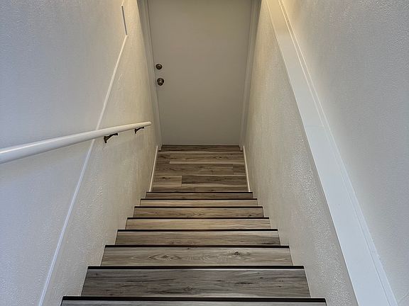 Stairs from separate entrance/mudroom to the apartment.