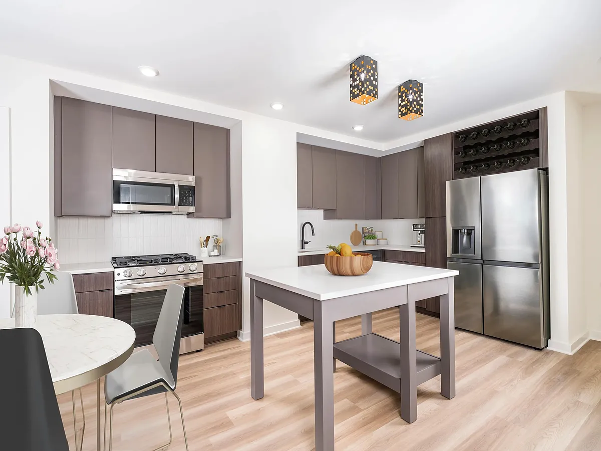 Discover your dream home at Modera Parkside! Our premium collection homes feature elegant under-cabinet kitchen lighting, distinctive fixtures, upgraded countertops, a stylish tile backsplash, and a captivating two-tone cabinet finish that elevates your l - Modera Parkside