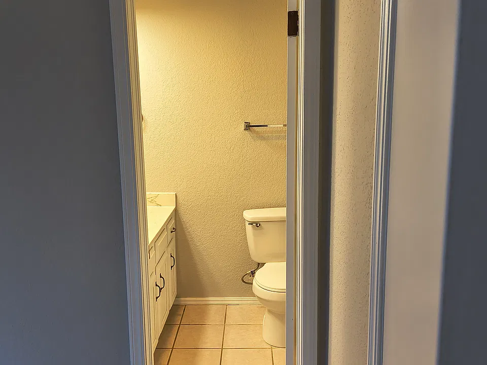 bathroom with vanity upstairs guest room also has a walk in closet