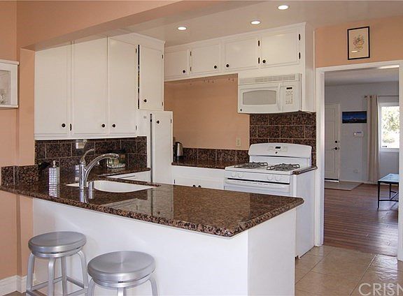 Kitchen (fridge to right of doorway from this view