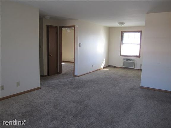 Living looking into dining and bedroom 1