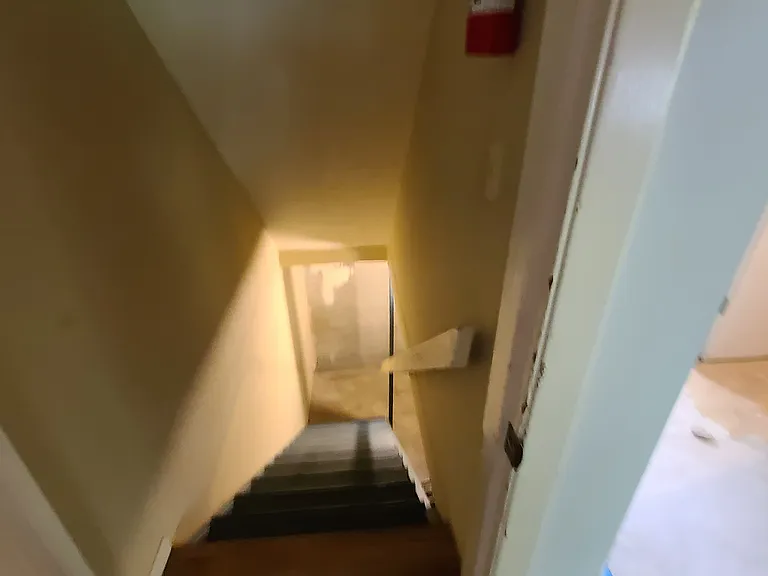 This photo is from when this unit was rented in 2021. stairs to basement