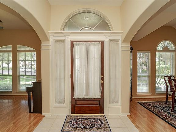 Enter front door with Dining Room to the left (on right in this picture) and living room/study to the right (left in this picture)