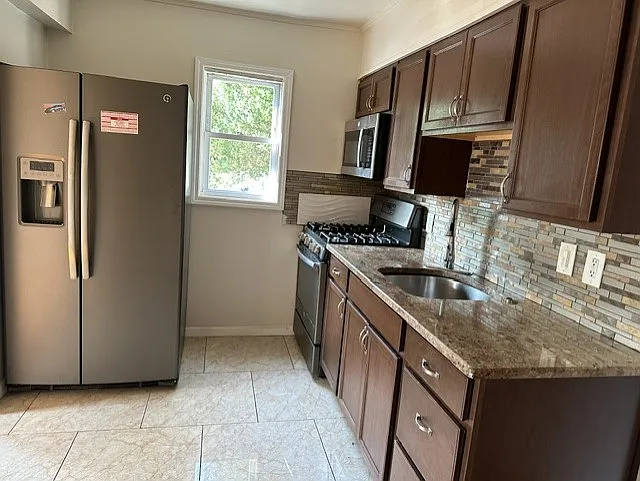410 Herricks Rd — Photo 5
