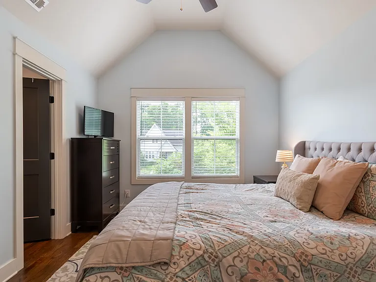 A large walk-in closet offers ample storage.