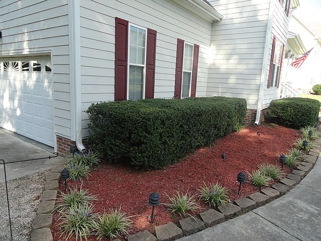 Front walk leading to front door.