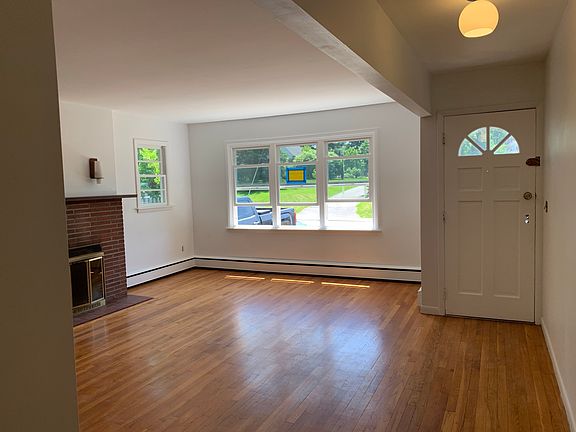 Entry door and living room picture window.