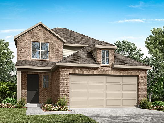 A two-story brick house with a garage, surrounded by lush greenery and a clear blue sky.