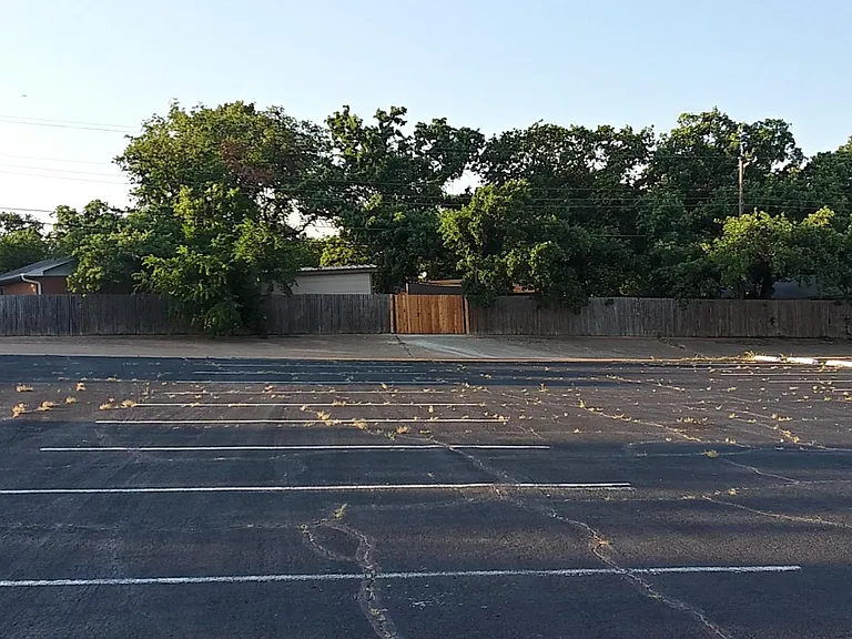 Commercial parking lot behind apt