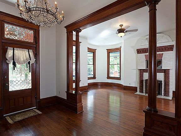 Entry way leading into formal living room. Beautiful stained moldings.