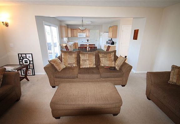 VIEW FROM GREAT ROOM WITH EATING AREA AND KITCHEN IN THE BACKGOUND