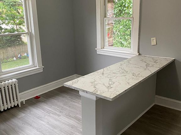Entertainment area, to the left of the kitchen Island.