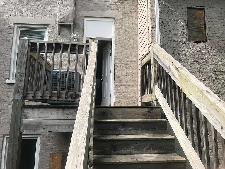 Stairs leading down to backyard.
