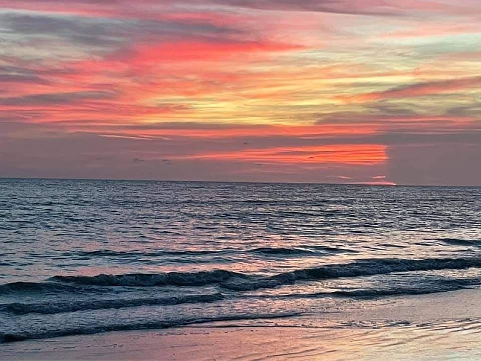 sunset on the beach across the street