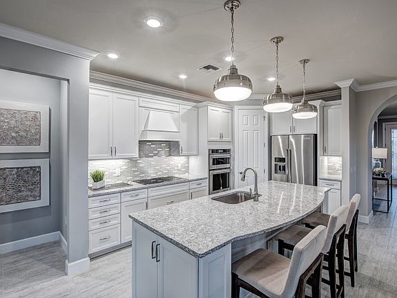 Large kitchen island with quartz countertops