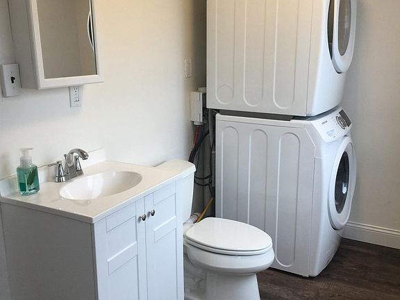 1st Floor Half bath. Kohler Toilet. Medicine Cabinet. Full Size Samsung Washer and Dryer.