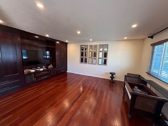 Living room with built in media cabinets.