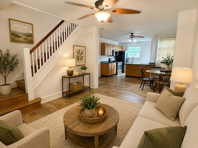 Living Room - This photo features virtual staging (AI-generated furniture) to help show the potential layout of the room. The property is being rented unfurnished.