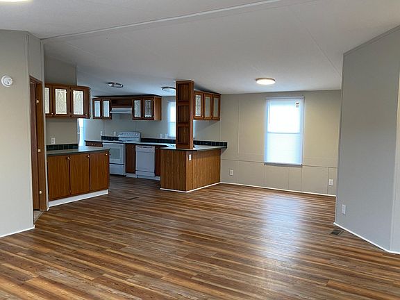 Standing in den looking toward dining area and kitchen