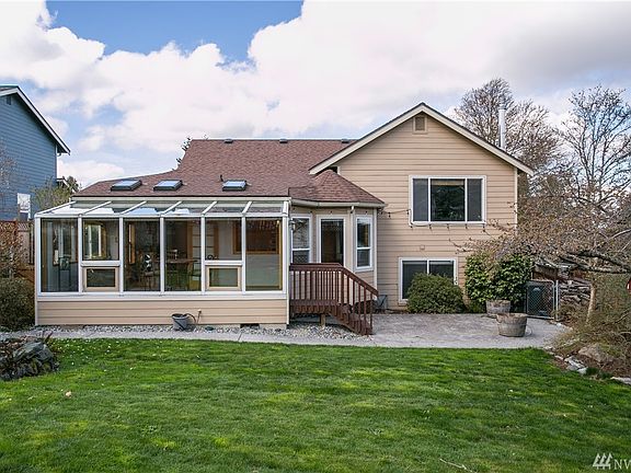 Gorgeous backyard, glass sunroom lets you enjoy the backyard all year round. Paved patio, fully fenced yard with dog run. Aggregate walkway around full back of house. Large stamped concrete patio.