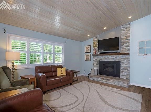 sturdy plantation blinds create warmth and charm in this home
