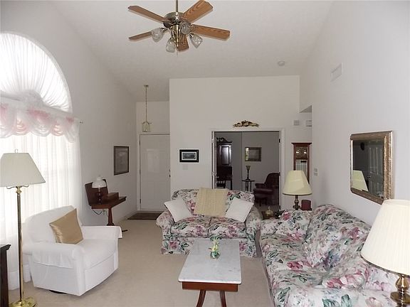 Second angle of great room with excellent view of cathedral ceiling and view of den.