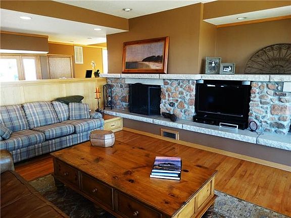 Spacious upstairs living area, includes tremendous natural light and a fireplace.