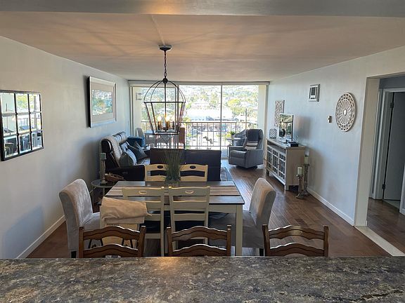 Dining room with seating for six. Breakfast bar with seating for three.