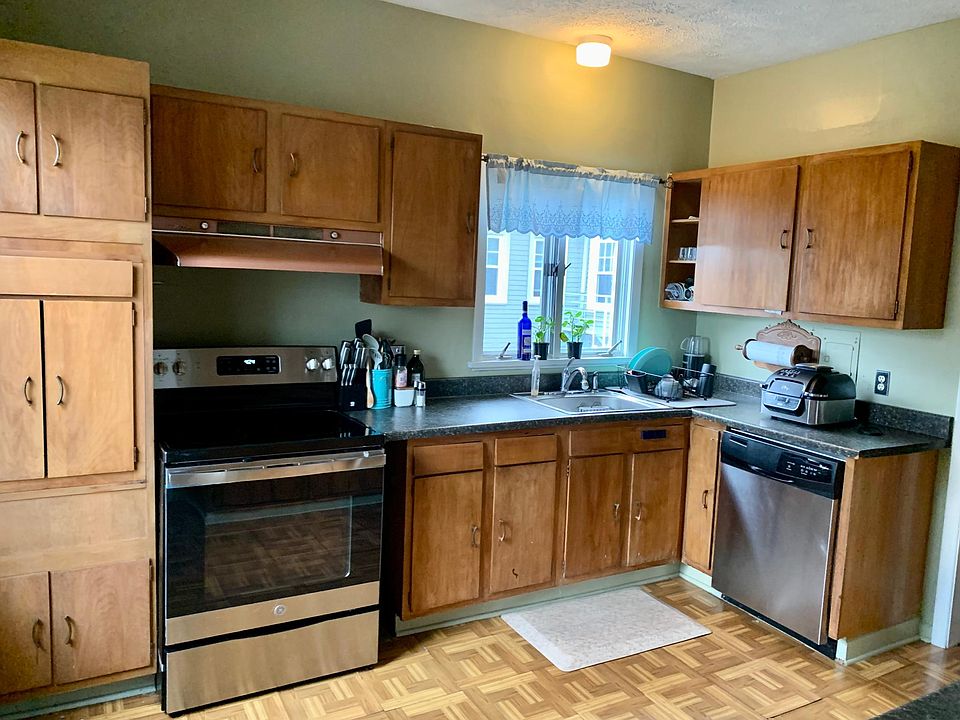 Large kitchen has all stainless appliances including brand new, smooth cooktop range. Parrquet floor. High ceiling. Many cabinets.