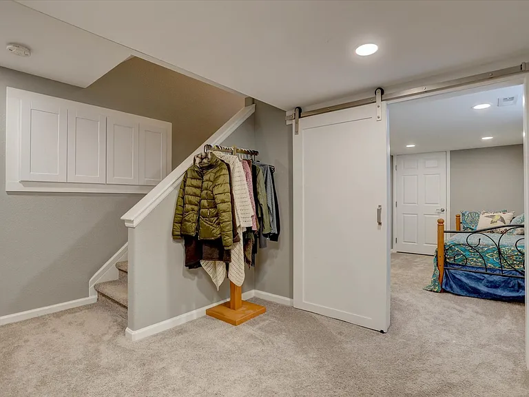 finished basement with barn door to bedroom and private bath ensuite
with additional bonus room