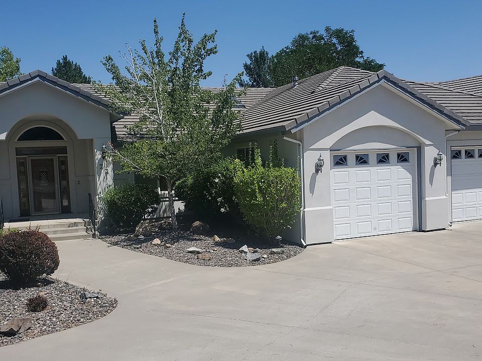 Front of House with 3 Car Garage and Circle Driveway.