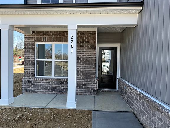 Exterior - Earthy textures and warm tones feel rooted in place.