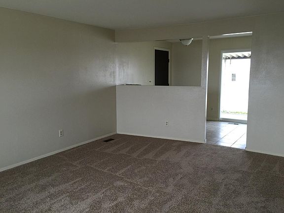 Open living room to dining and back patio.