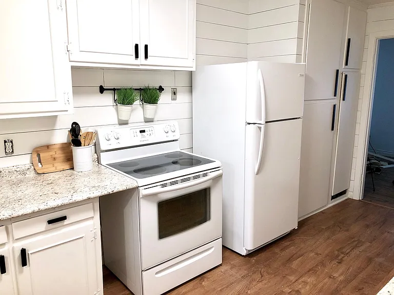 New stove and refrigerator with ice-maker.