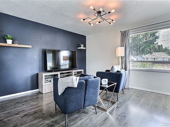 Another view of living room. New light fixtures throughout the home! 