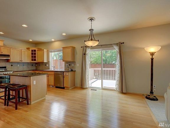 Plenty of room for a table right off the kitchen by the family room. You also have seating at the kitchen island.