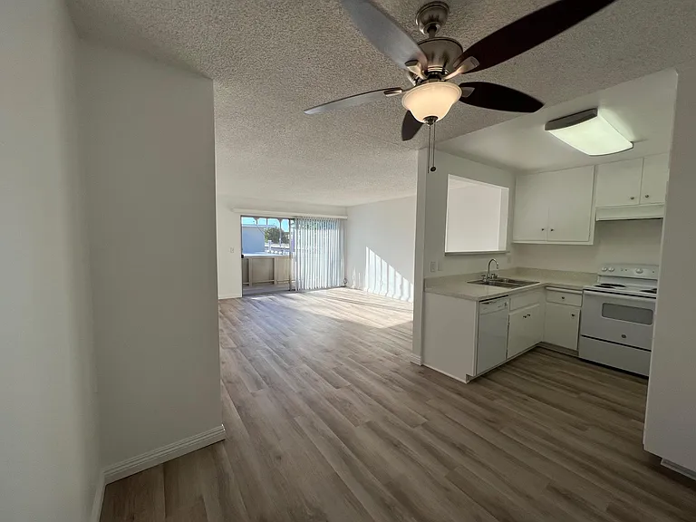 Standing in dining room looking out toward balcony (2x2)