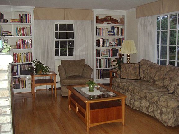 Living Room with original hardwood floors and built-in bookcases.