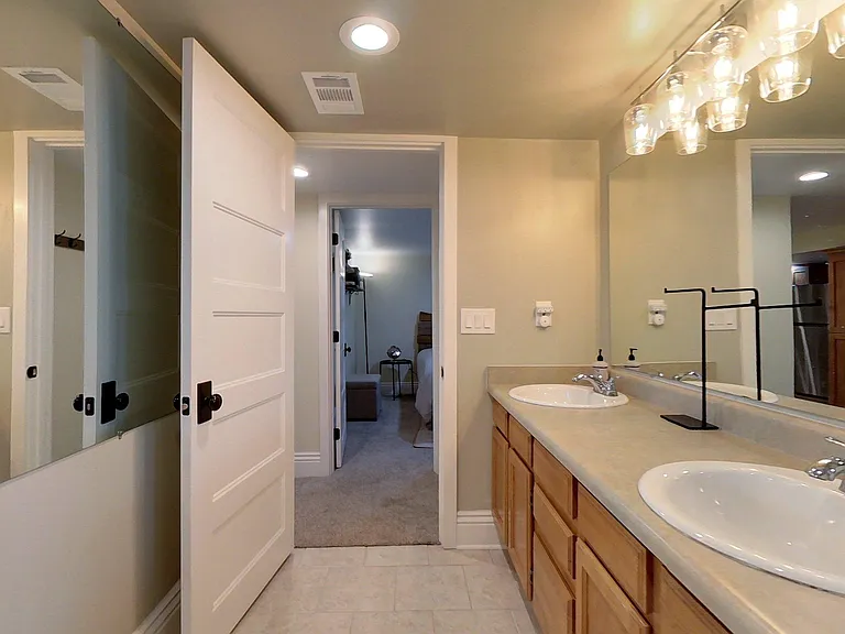 Downstairs bathroom with double sink.