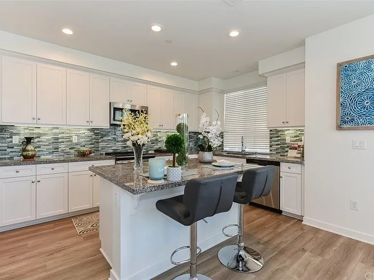 Kitchen with spacious island, generous counter space and storage, including walk-in pantry