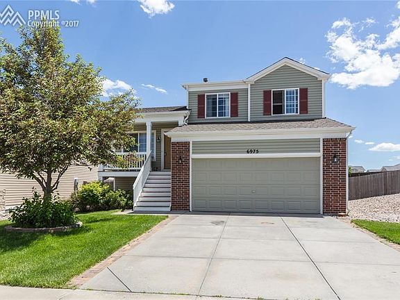 Lovely home with great curb appeal. Welcome home! (summer photo).