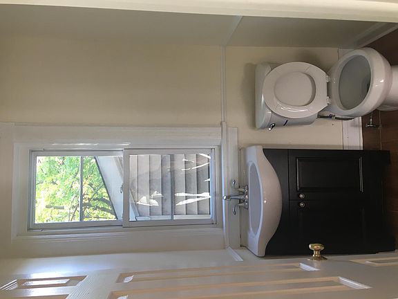 Half bathroom next to kitchen