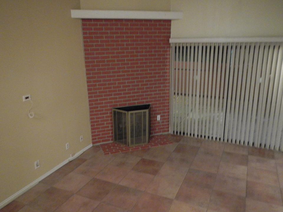 sunken living room with gas fireplace