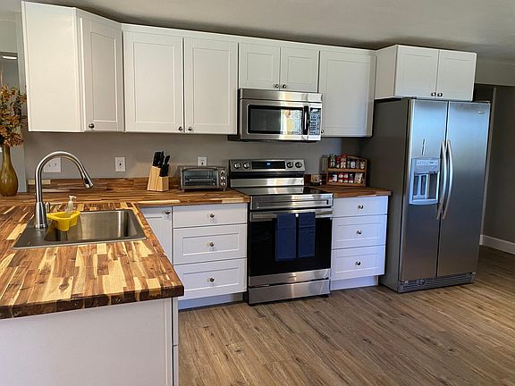 Large kitchen with butcher block countertops
