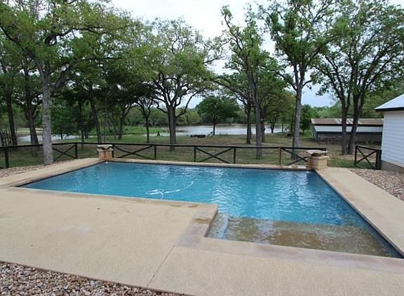 Beautiful salt water pool with water features, color lighting selections, & sundeck. Automatic (with