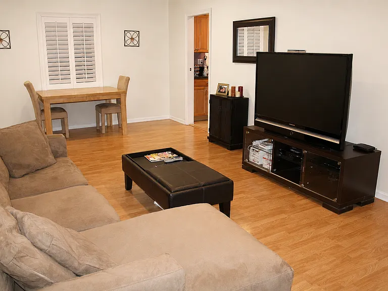 Living room and dining area with plantation shutters